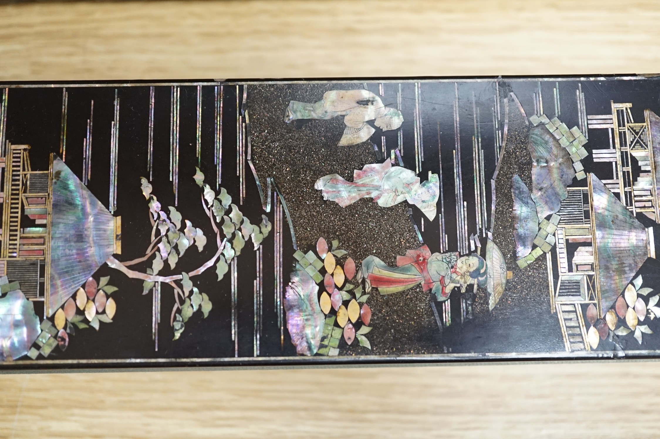 A late 19th century Chinese lacquer box, two smaller Japanese lacquer boxes, a doll, a collection of later paper fans etc, Chinese box 24cms high x 42cms wide